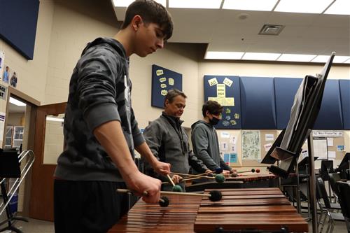 Band students and teacher playing the vibraphone